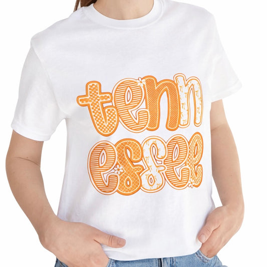 White t-shirt with orange text 'tennessee' worn by a person on a white background